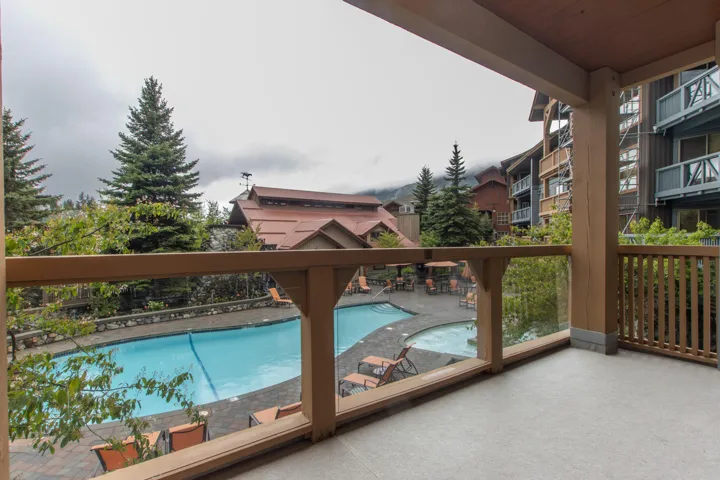 Community pool with a patio