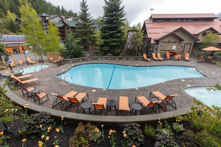 Community pool featuring a patio