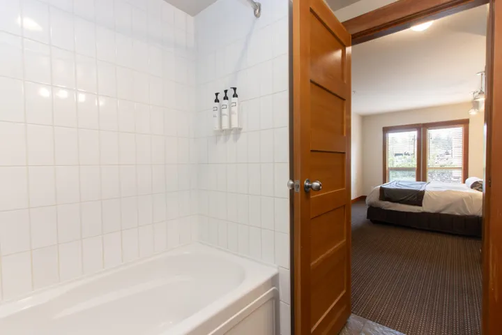 Full bathroom featuring connected bathroom