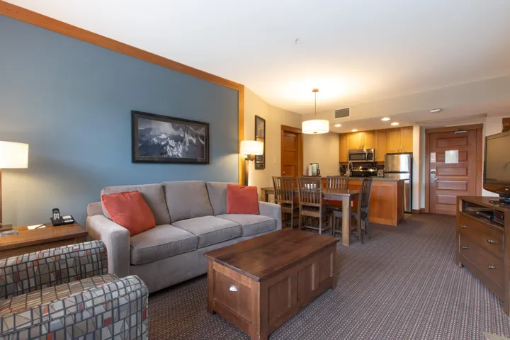 Carpeted living area featuring recessed lighting