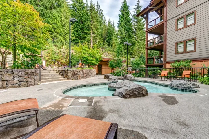 View of pool with a patio and stairs