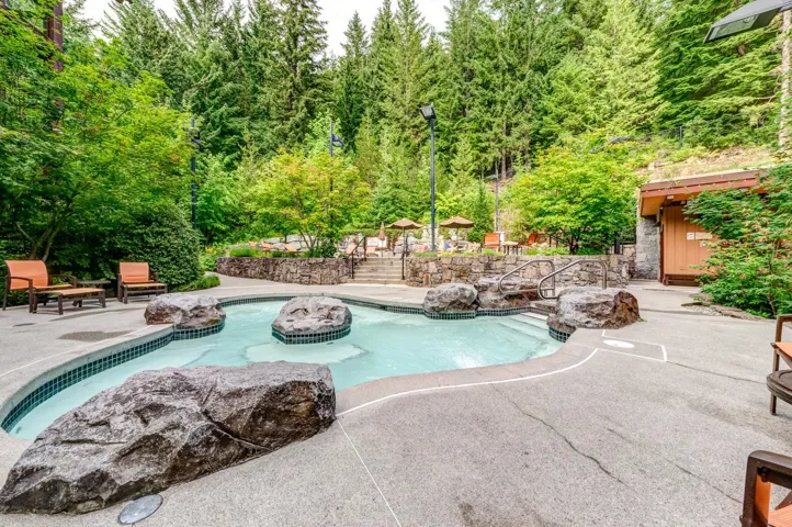 Swimming pool with a patio area