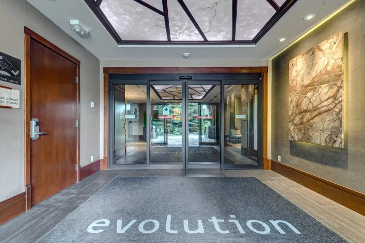 Building lobby featuring a sunroom and recessed lighting