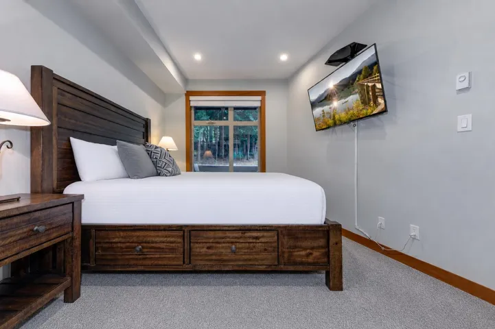 Bedroom featuring a large window, recessed lighting, and light gray wall paint