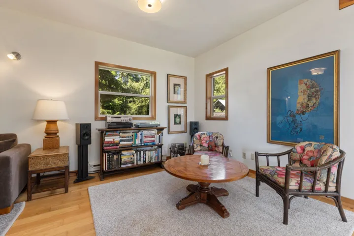 Bright interior space featuring light-toned wood-finish flooring