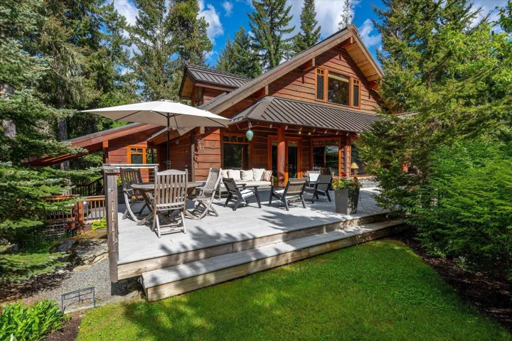Spacious outdoor deck with multiple seating areas, a multi-level design, and direct access to the interior