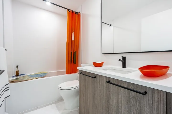 Full bath featuring vanity and shower / bathtub combination with curtain