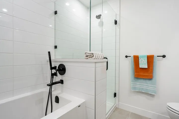 Bathroom featuring a shower stall, a bath, and light tile patterned floors