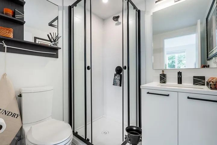 Full bath featuring vanity and a stall shower