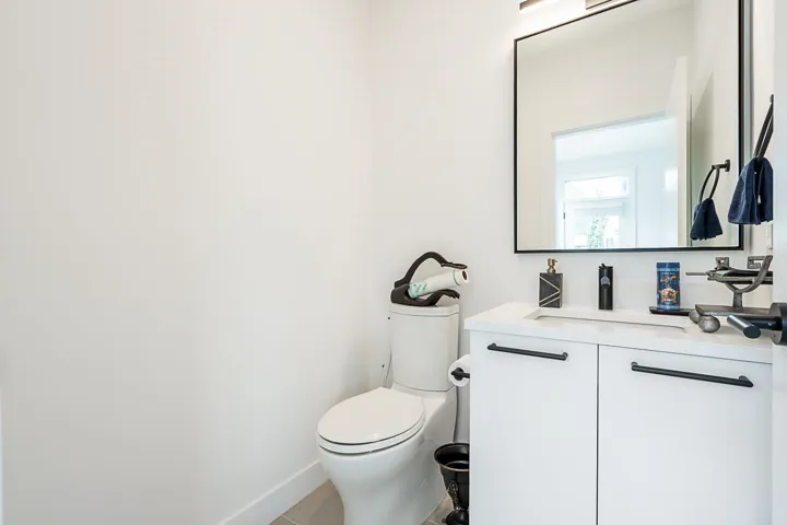 Half bath with vanity and toilet