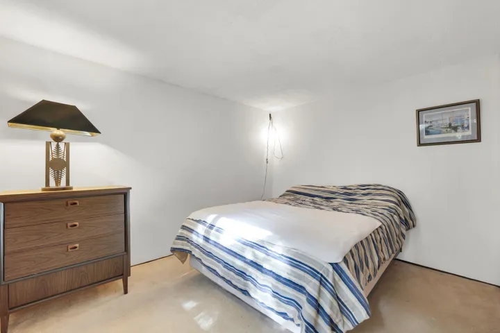 Bedroom with finished concrete flooring
