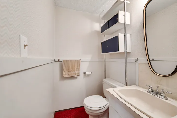 Bathroom with vanity and a textured ceiling