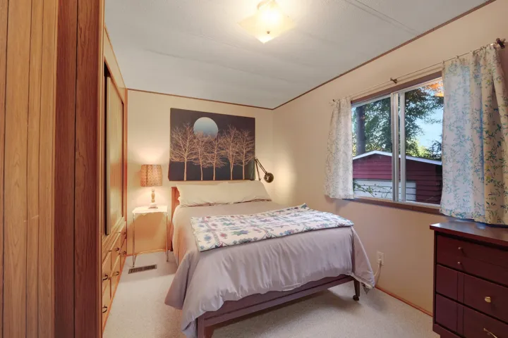 Bedroom with light carpet