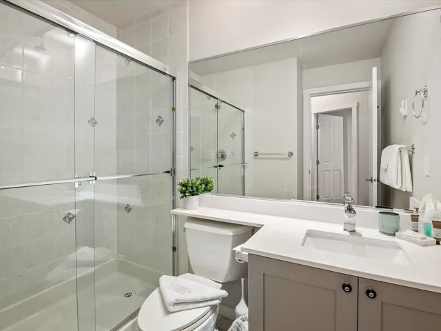 Full bathroom featuring vanity and a shower stall