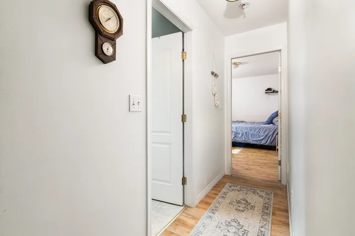 Hallway featuring light wood-style flooring