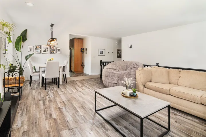 Living area featuring light wood finished floors and baseboards