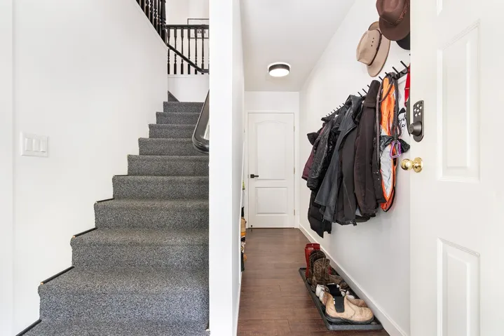 Staircase featuring wood finished floors