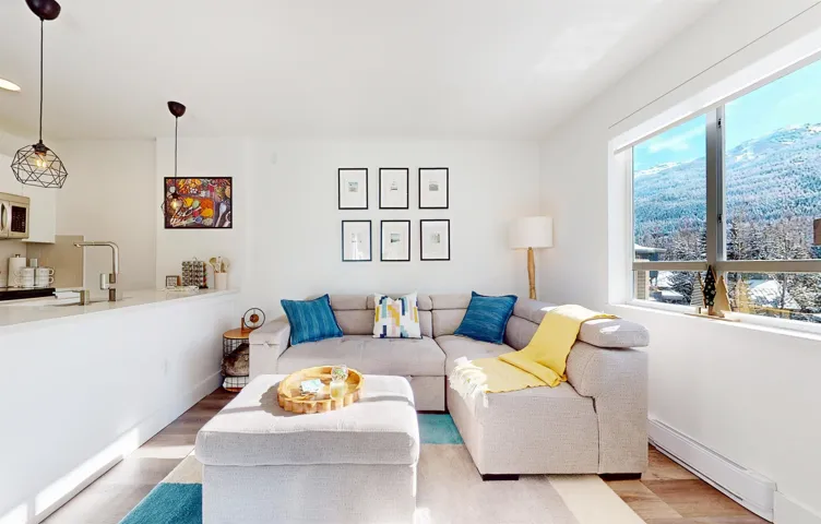 Living room with wood finished floors and baseboards