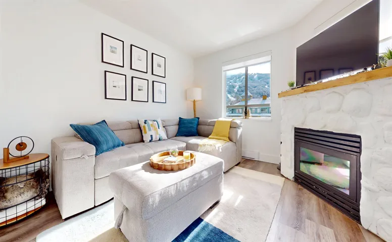Living area featuring wood finished floors and a fireplace