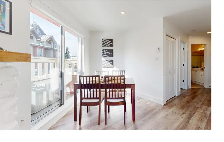 Dining area featuring light wood-style floors and recessed lighting