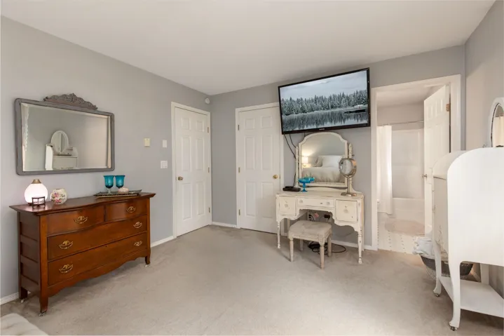 Living area featuring baseboards and carpet