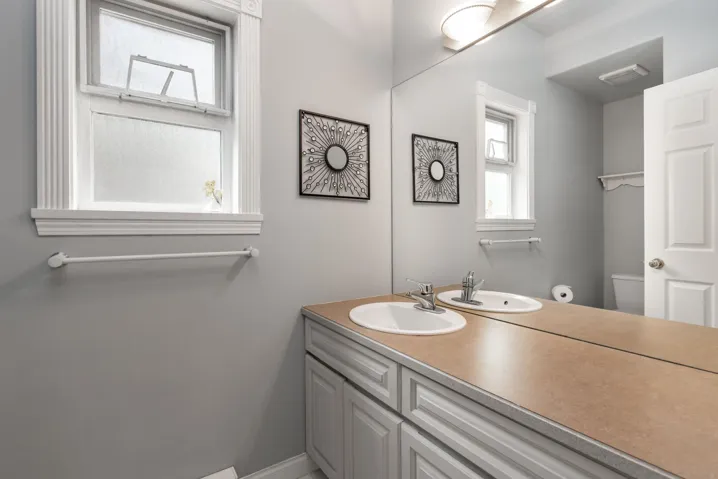 Half bathroom featuring toilet and vanity