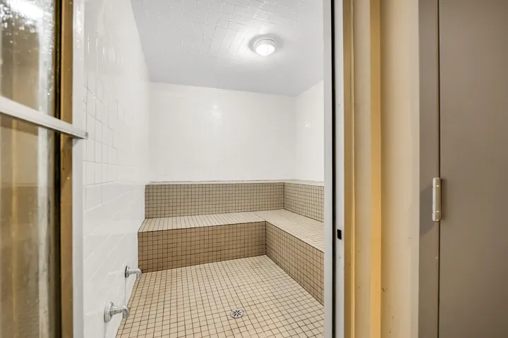Full bath featuring a stall shower and a sauna