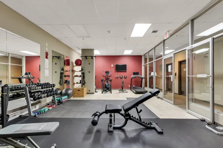 Workout area with a paneled ceiling