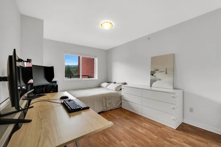 Bedroom featuring light wood-style floors and baseboards
