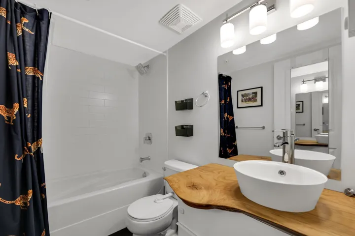 Full bathroom with vanity and shower / bath combo with shower curtain