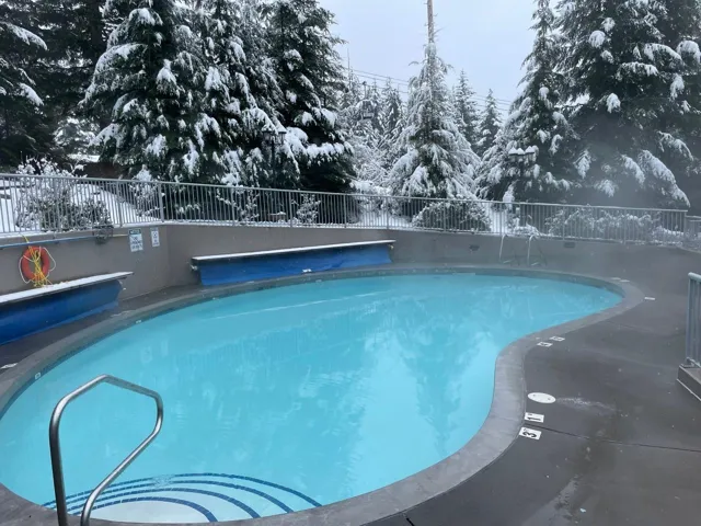Community pool featuring fence