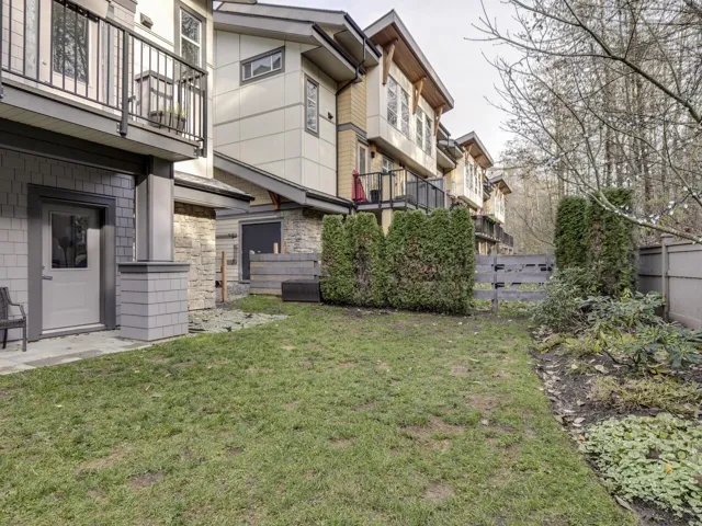 View of yard featuring a balcony