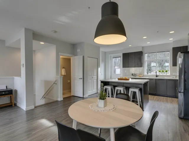 Dining room featuring light wood-type flooring and recessed lighting