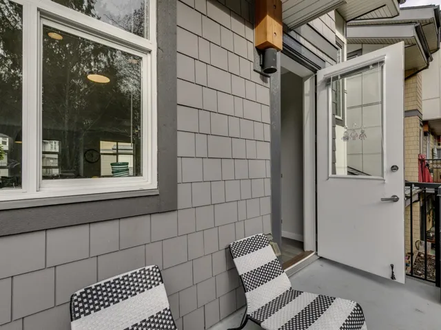 Bathroom featuring tile walls, concrete floors, and plenty of natural light