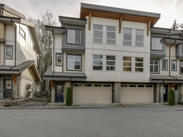 Modern home featuring stucco siding and a garage