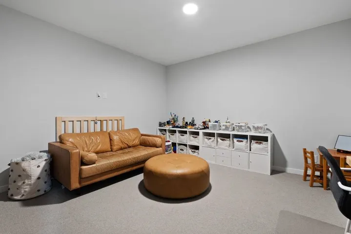 Living room featuring carpet and baseboards