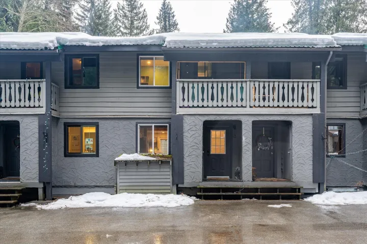 View of front of house featuring a balcony