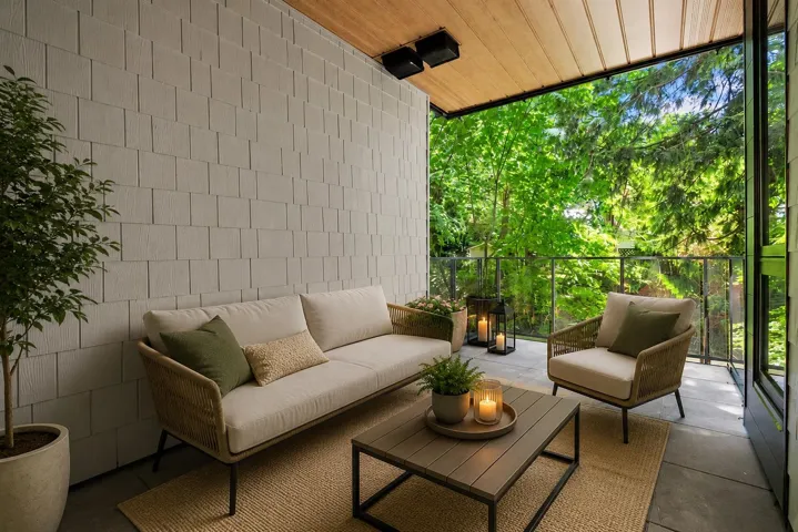 Covered outdoor patio featuring a wood-panel ceiling and shingle-style siding