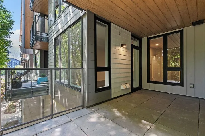 Outdoor patio featuring concrete flooring and a wood-finish ceiling