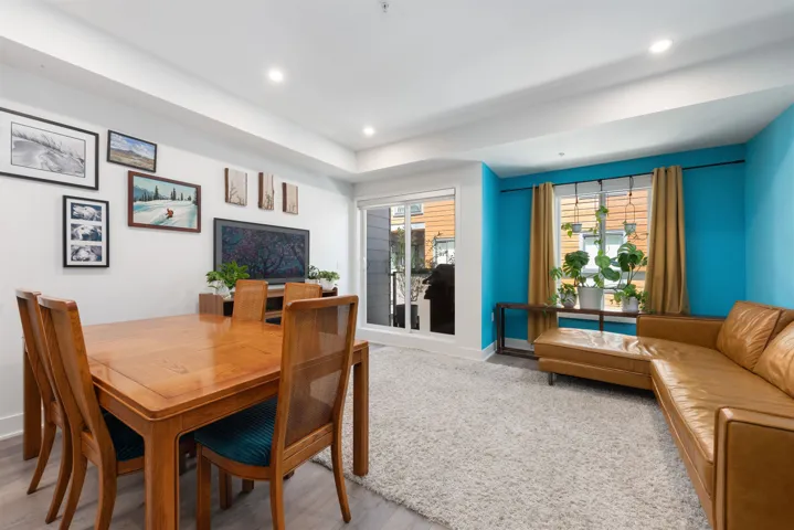 Dining room with recessed lighting and wood finished floors