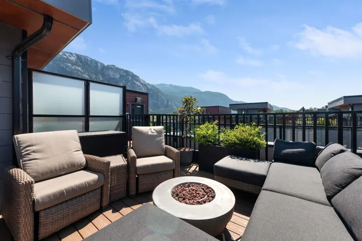 Patio / terrace with an outdoor living space with a fire pit and a mountain view