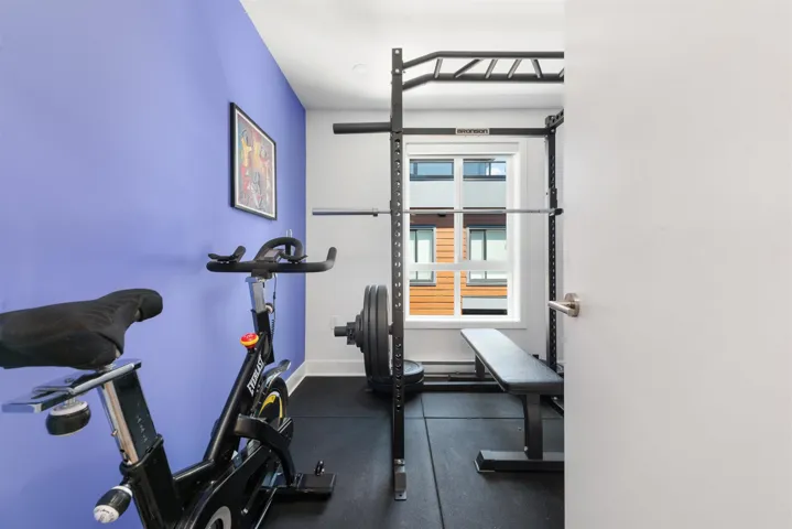 Workout room featuring baseboards