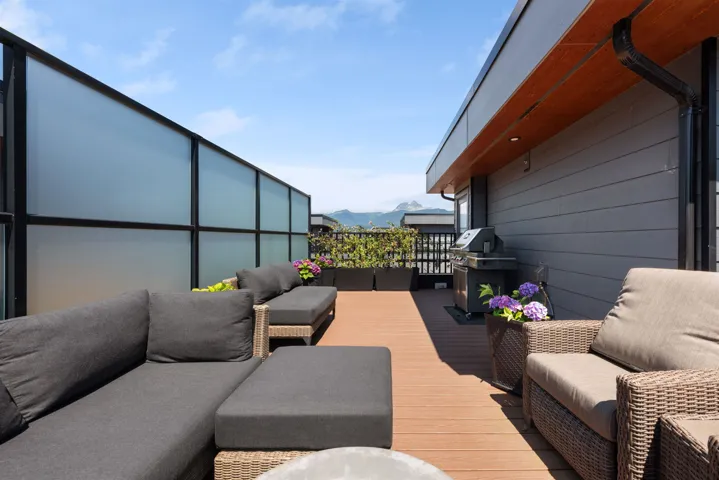 Deck with an outdoor hangout area and a mountain view