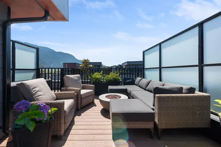 Balcony with an outdoor living space with a fire pit and a mountain view