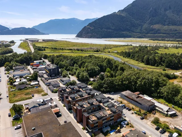 Aerial view of property's location with a water and mountain view