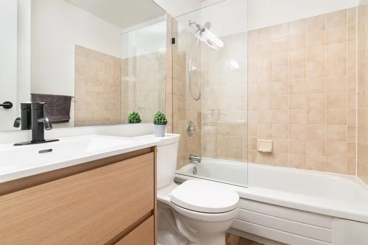 Full bath featuring shower / washtub combination and vanity