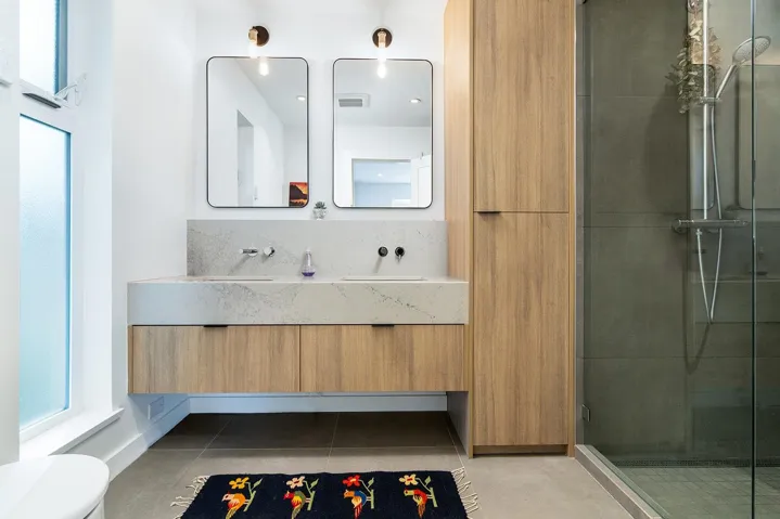 Full bathroom with vanity, a shower stall, light tile patterned flooring, and decorative backsplash