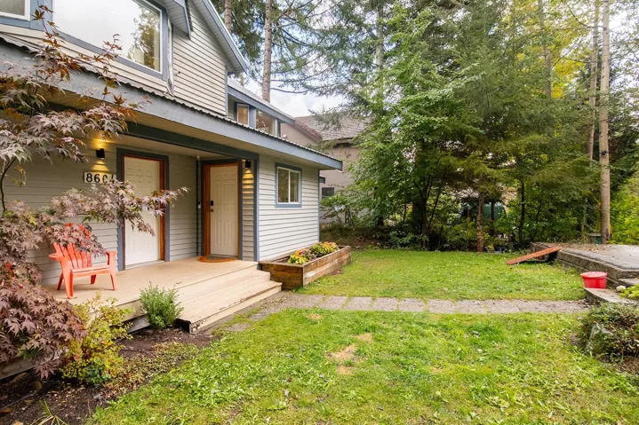 View of grassy yard featuring a deck