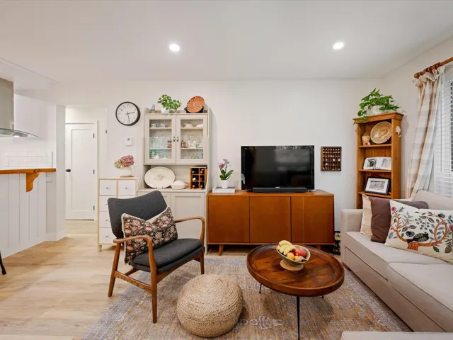 Living room featuring light wood finished floors and recessed lighting