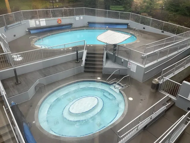 Community pool featuring a community hot tub and a patio area